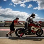 working as a motorcycle race technician
