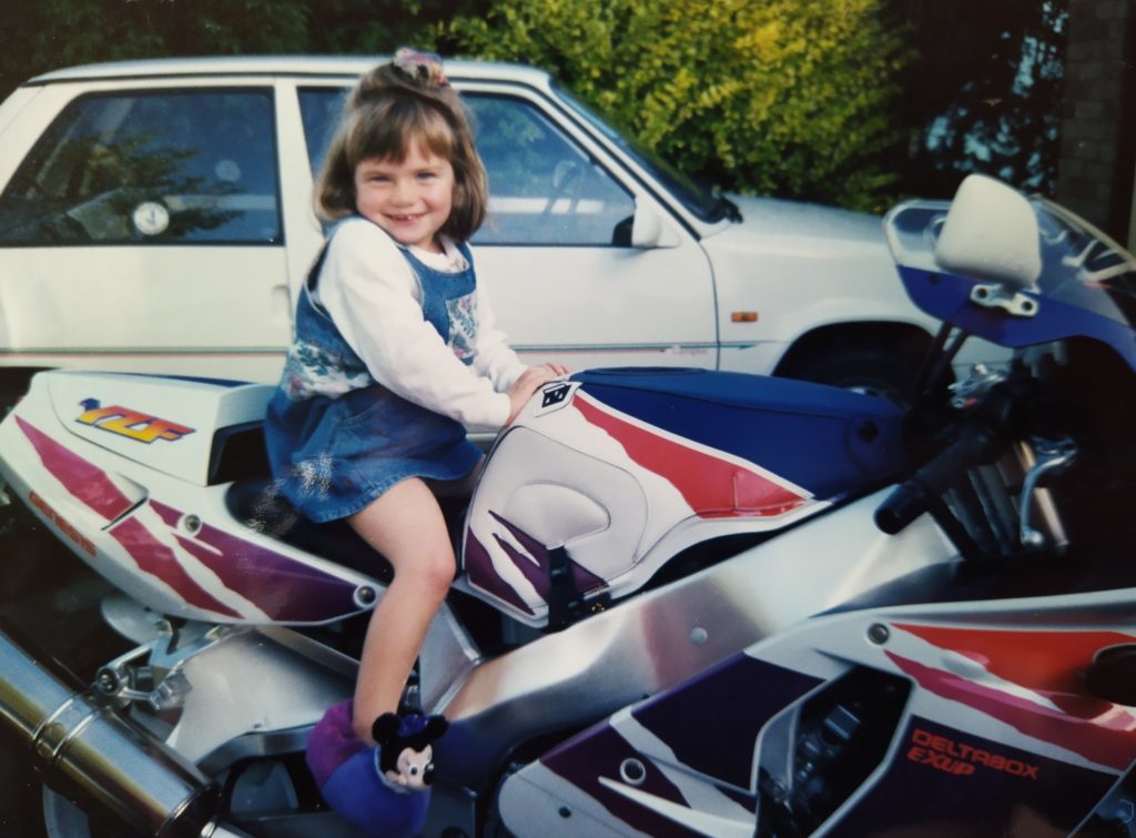 me as a girl sitting on a motorcycle
