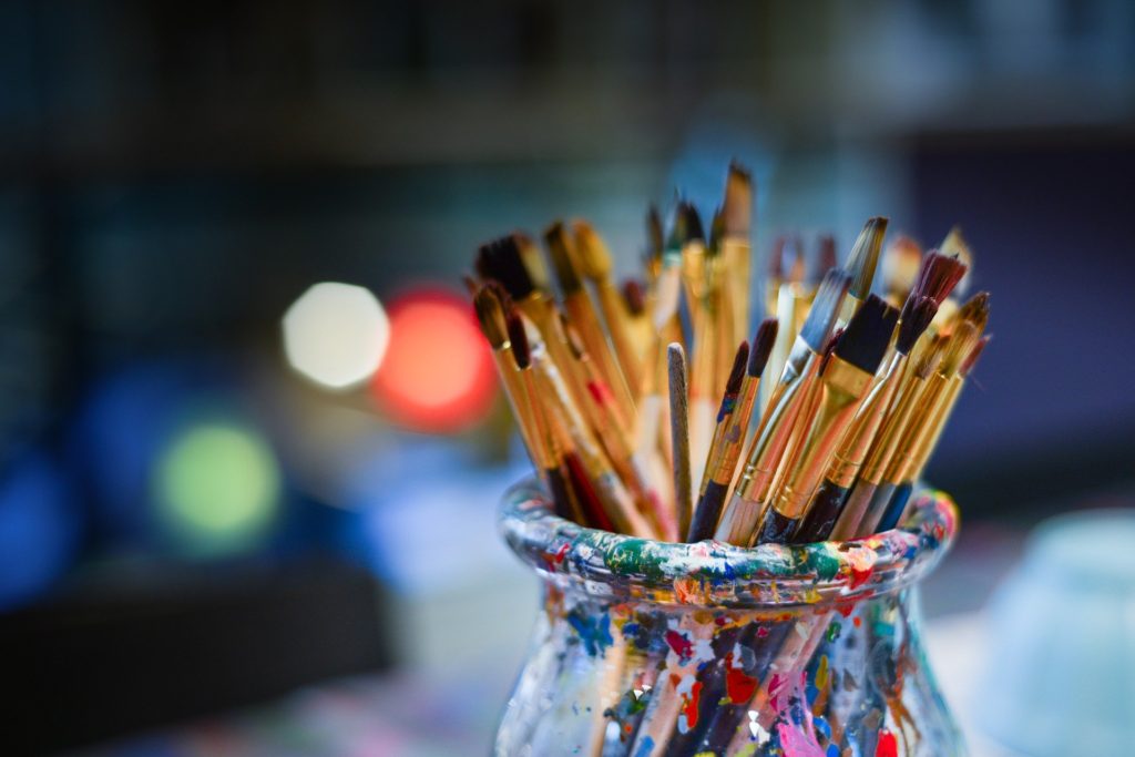 Paintbrushes in a pot, showing you can start new hobbies in your old commuting time