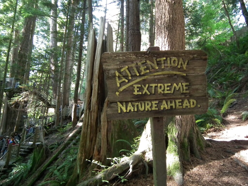 extreme nature ahead sign in the forest